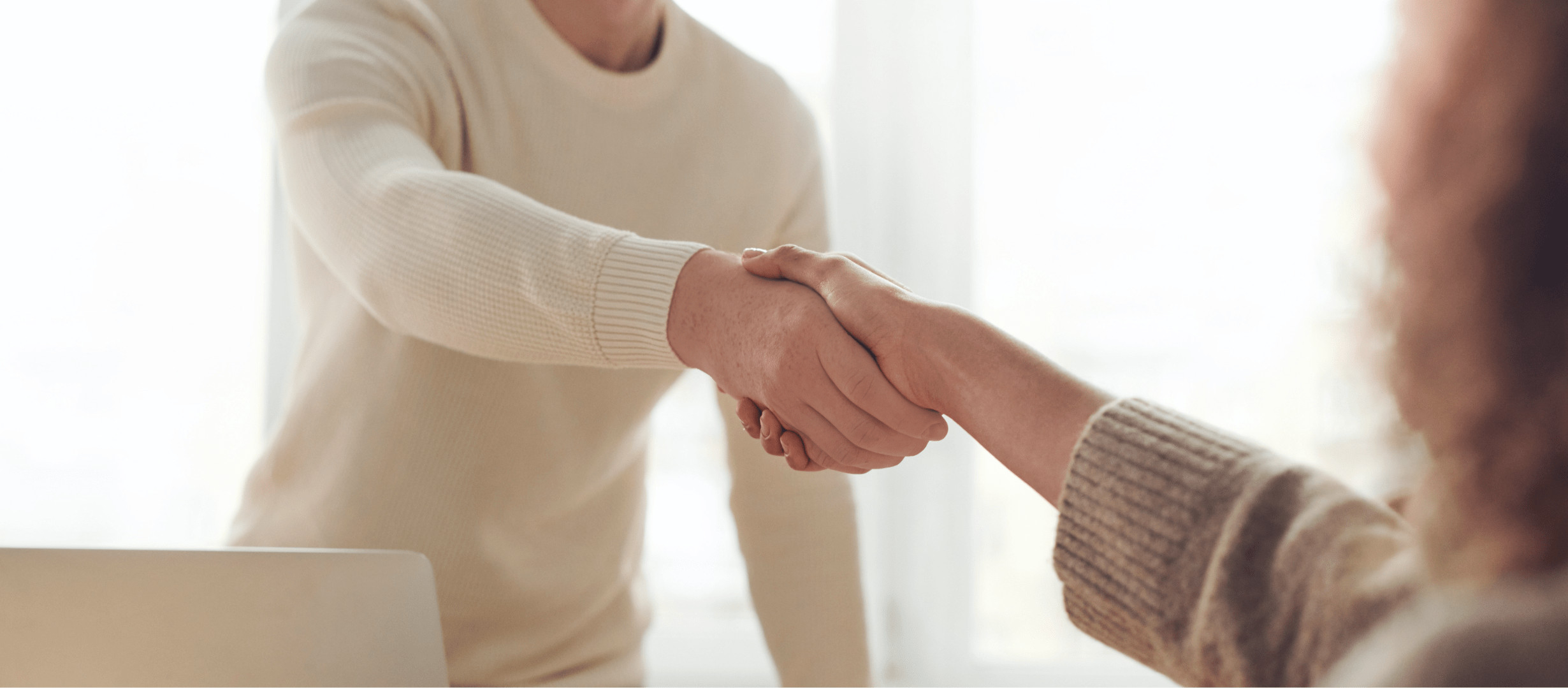 Man and woman shaking hands